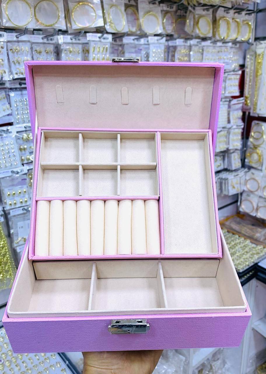 Coffret à bijoux rose avec compartiments multiples